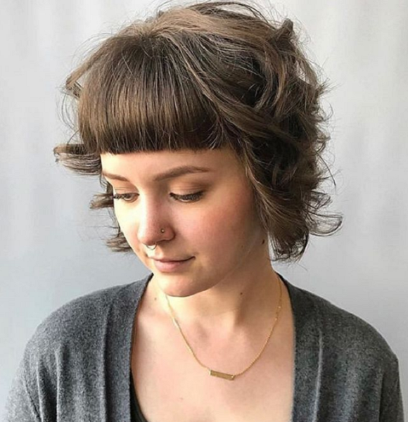 Short-Curly-Haircut-with-Baby-Bangs