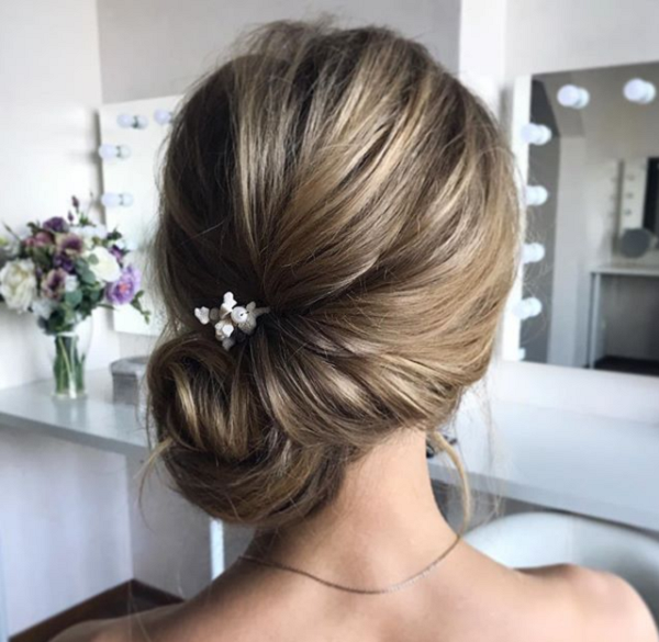Side Twisted Low Bun with Accessory Updos for Medium Hair