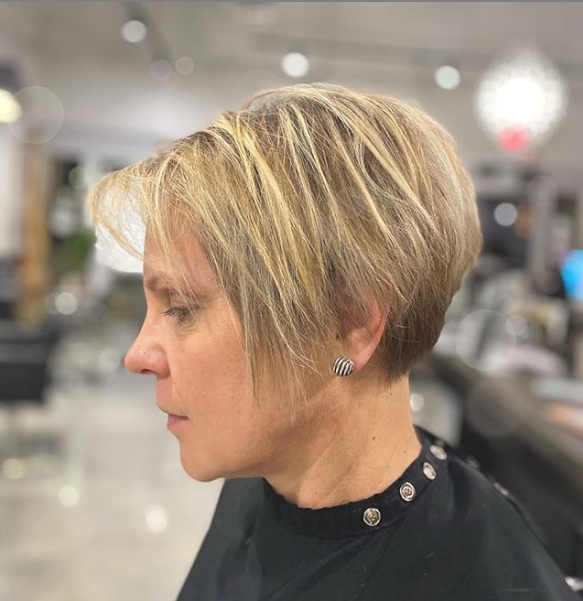 Modern Wedge Haircut with Blonde Highlights and Long Sides