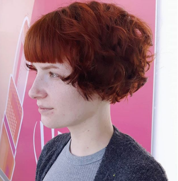 Retro Short & Curly Wedge Hairstyle with Blunt Bangs