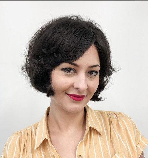 Retro Side-Parted Wedge Haircut with Wispy Ends