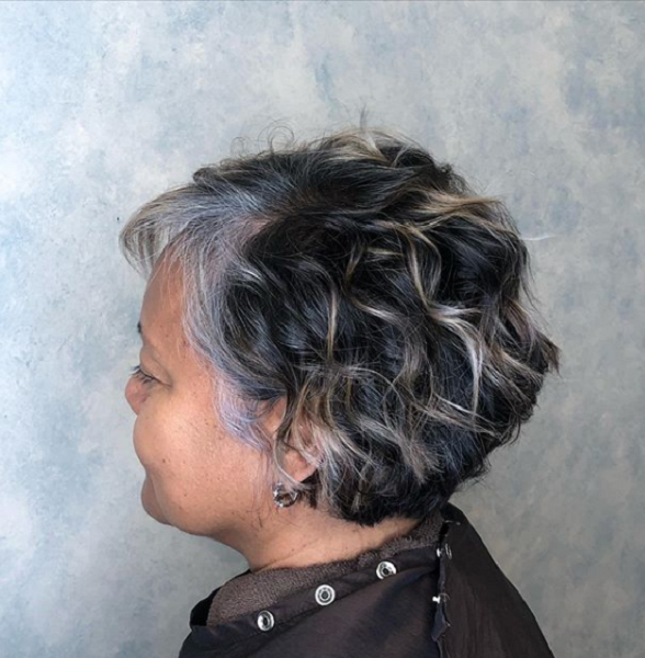 Wavy Side-Parted Wedge Haircut with Lighter Highlights