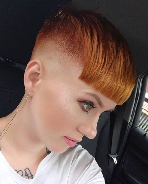 Sleek Short Haircut with Blunt Bangs and Side and Nape Undercut