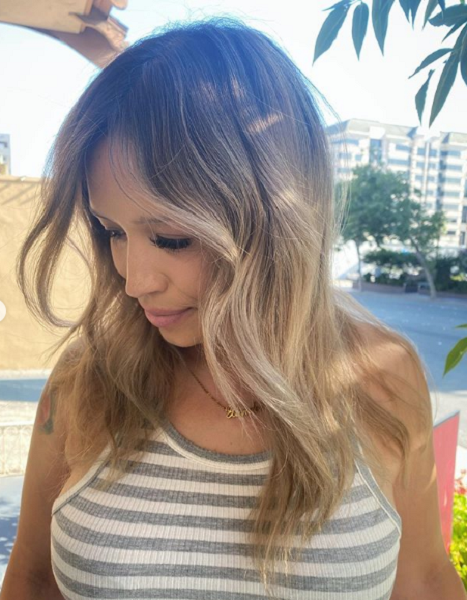 Wavy Middle-Parted Layered Haircut with Lighter Ends