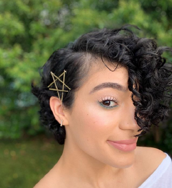 Curly Pixie Cut with Long Side-Parted Bangs and Hair Accessories