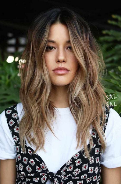 Wavy Middle-Parted Medium-Length Layered Hairstyle