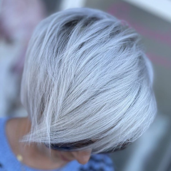 Messy Platinum Short Style - a woman wearing shades.
