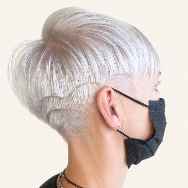 Short Layered Blonde Hairstyle - a woman wearing black facemask.