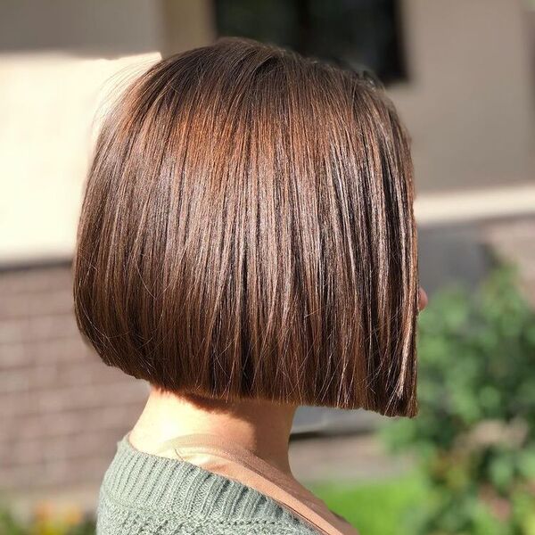 Soft Blunt Bob Hairstyle- a woman wearing a sweater.