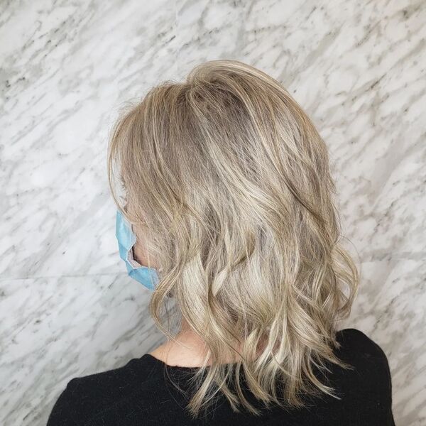 Wispy Baby Blonde Hair - a woman wearing blue surgical mask.
