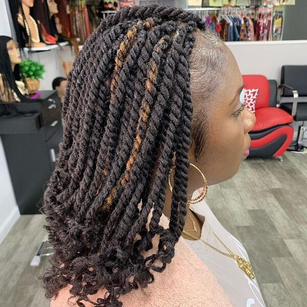Kinky Twist with Curly at the End - a woman inside a salon