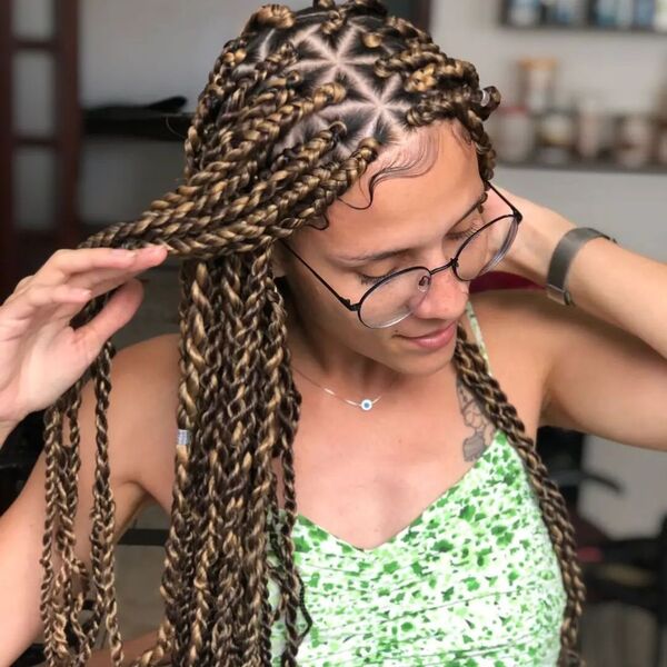Long Individual Twists with Highlights - a woman wearing a eyeglasses