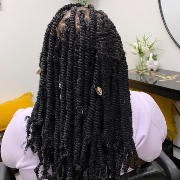 Medium and Thick Twists Hairstyle - a woman inside a salon
