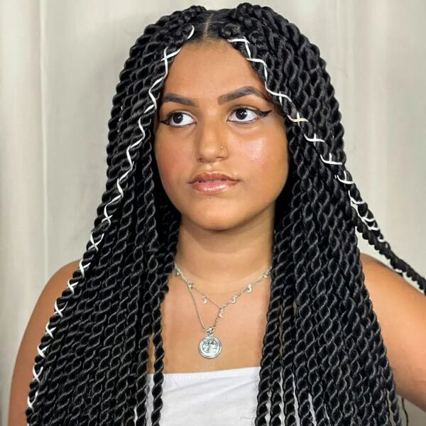 Middle-Parted Tribal Twists - a woman wearing a necklace