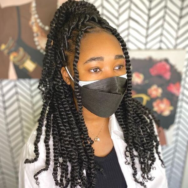 Passion Twist on a Ponytail Style - a woman wearing a black facemask
