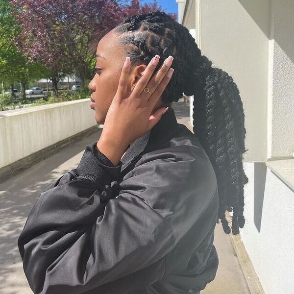 Rope Twists on a Ponytail - a woman wearing a black jacket