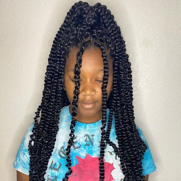 Small Knotless Passion Twists - a woman wearing a tie dye printed shirt