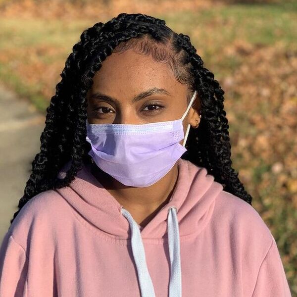 Small Twist on a Natural Hair - a woman with facemask wearing a pink hooded jacket