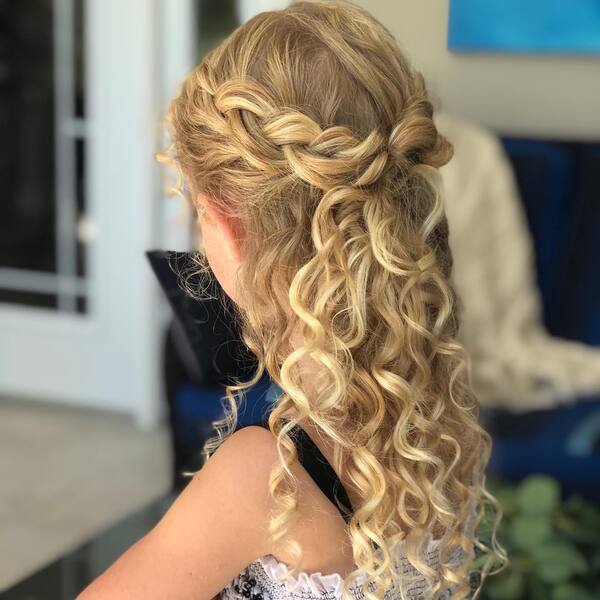 Blonde Curly Updo with Braids - a woman wearing a spaghetti strap top