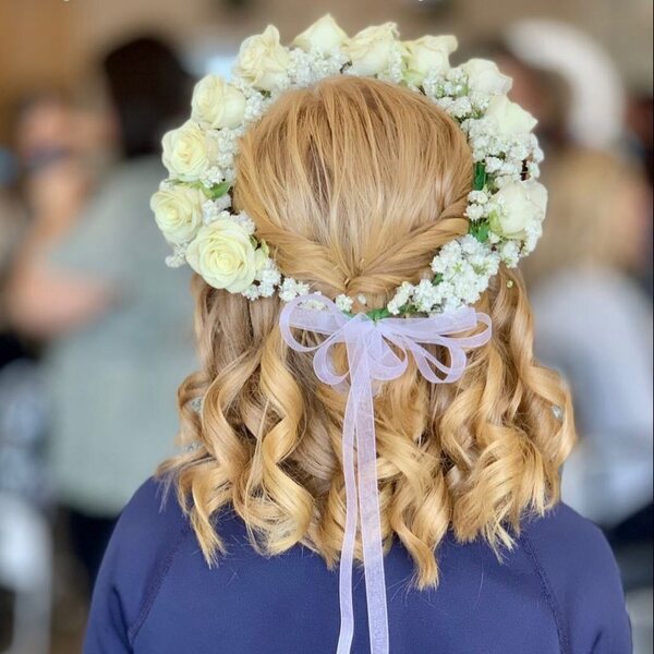 Curly Twist Hairstyle with Flower Crown - a woman wearing a blue longsleeve