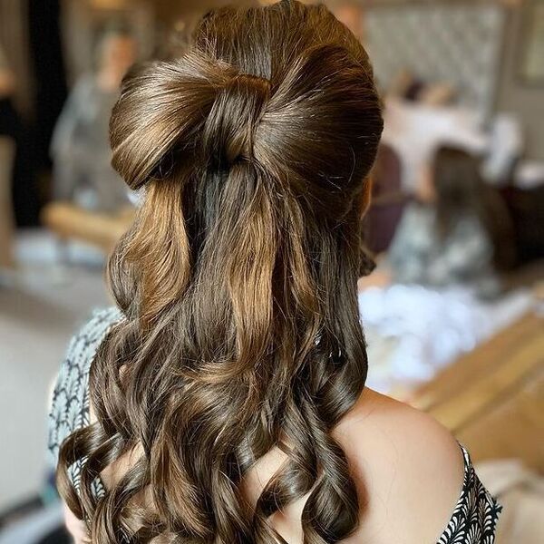 Flower Girl Bow Hairstyle - a woman wearing a printed off shoulder dress