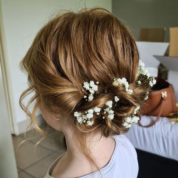 Flower Girl Bun Hairstyle - a woman with hair decor