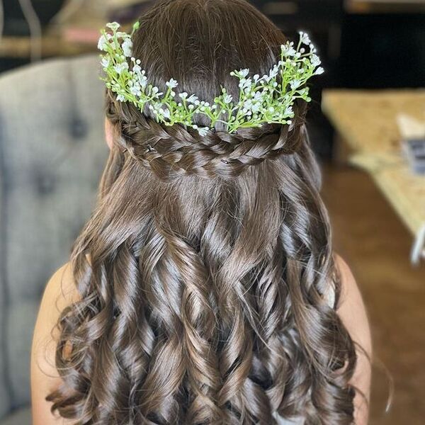 Halo Braid with Curls - a woman with flower decor