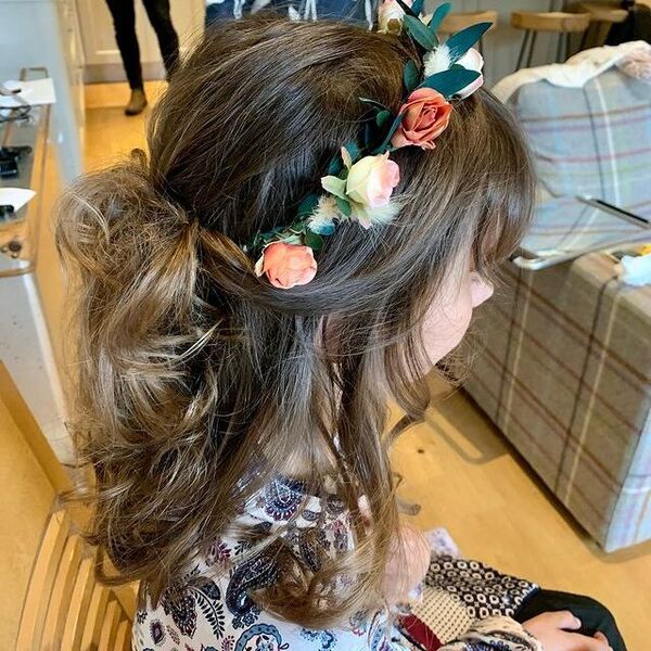 Messy Flower Girl Hairstyles with Flower Crown - a woman wearing a printed longsleeve blouse